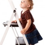 Baby Girl Looking Up and Climbing Ladder